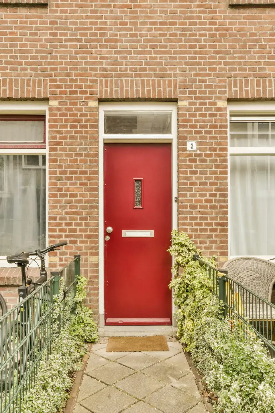 Home improvements for Newcastle terraced houses Red front door with a glass transom on a brick terraced house, typical of many Newcastle streets